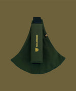 Wildride toddler carrier in army green. A 100% cotton seat stylish hip carrier for babies with brand name in yellow on the strap that's folded over the carrier's seat