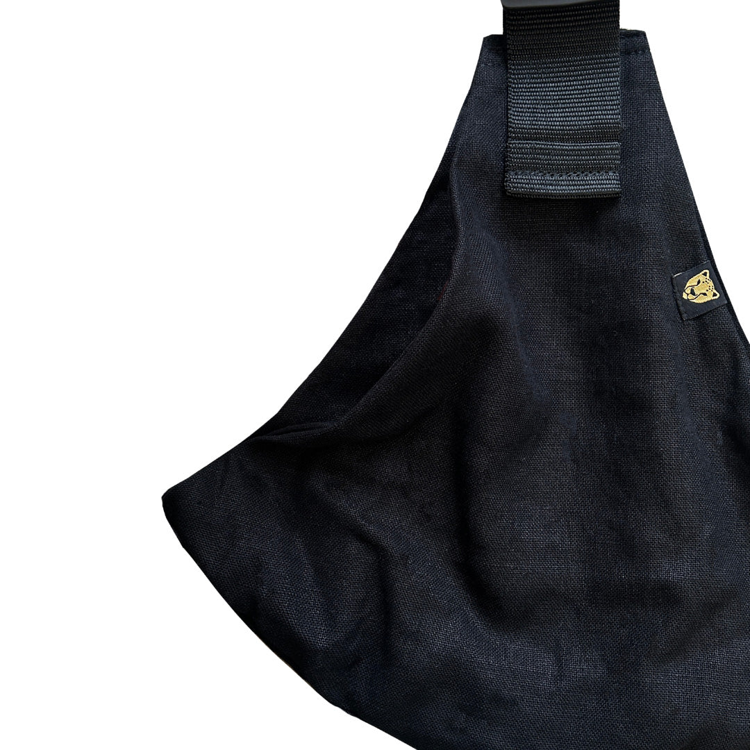 A closeup of the lovely black linen material used to make this hip seat carrier sling from Wildride