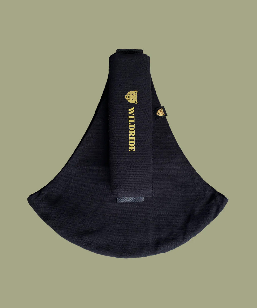 Wildride toddler carrier in black. A 100% cotton seat stylish hip carrier for babies with brand name in yellow on the strap that's folded over the carrier's seat