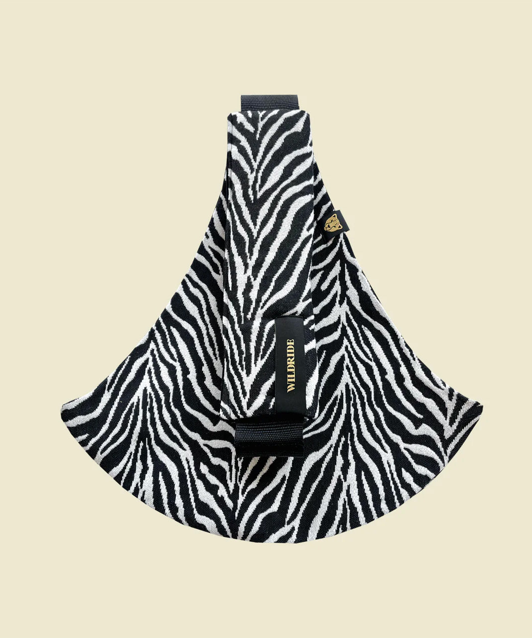 Wildride toddler carrier in black zebra stripe. A 100% cotton seat stylish hip carrier for babies in a zebra skin design