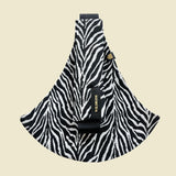 Wildride toddler carrier in black zebra stripe. A 100% cotton seat stylish hip carrier for babies in a zebra skin design