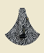 Wildride toddler carrier in black zebra stripe. A 100% cotton seat stylish hip carrier for babies in a zebra skin design