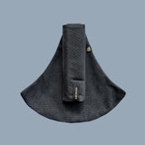 Wildride toddler carrier in graphite grey. A 100% cotton seat stylish hip carrier for babies with brand name on the strap that's folded over the carrier's seat