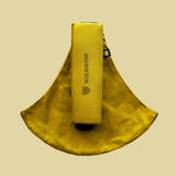 Wildride toddler carrier in desert yellow. A 100% cotton seat stylish hip carrier for babies with brand name on the strap that's folded over the carrier's seat