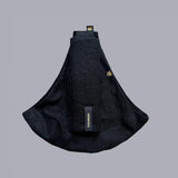 Wildride toddler carrier in black linen. A stylish hip carrier for babies with a black brand patch on the strap that's folded over the carrier's seat
