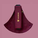 Wildride toddler carrier in merlot maroon. A 100% cotton seat stylish hip carrier for babies with brand name on the strap that's folded over the carrier's seat