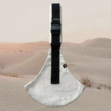 A side view of the sand linen Wildride toddler carrier showing the buckle and seat detail. Features a brand patch on the buckle.