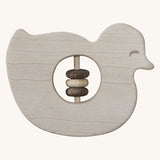 Wooden Story Baby Duck Rattle on a plain background. A baby duck shaped rattle with  cut-out in the middle which has three wooden rings on a wooden rod.