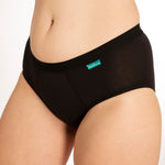 Close up of woman wearing the WUKA everyday bikini brief underwear on a grey background