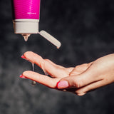 A lifestyle photo of the tube getting squeezed