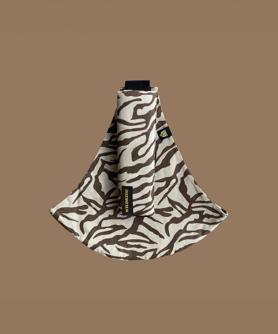 The Wildride toddler carrier in a brown zebra print design