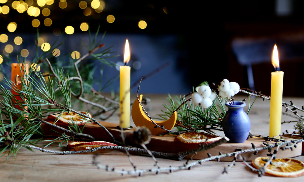Festive Grimm's Celebration Ring with lit candles, dried orange slices and foliage to represent 'The 12 Days of Yuletide' blog by Babipur.