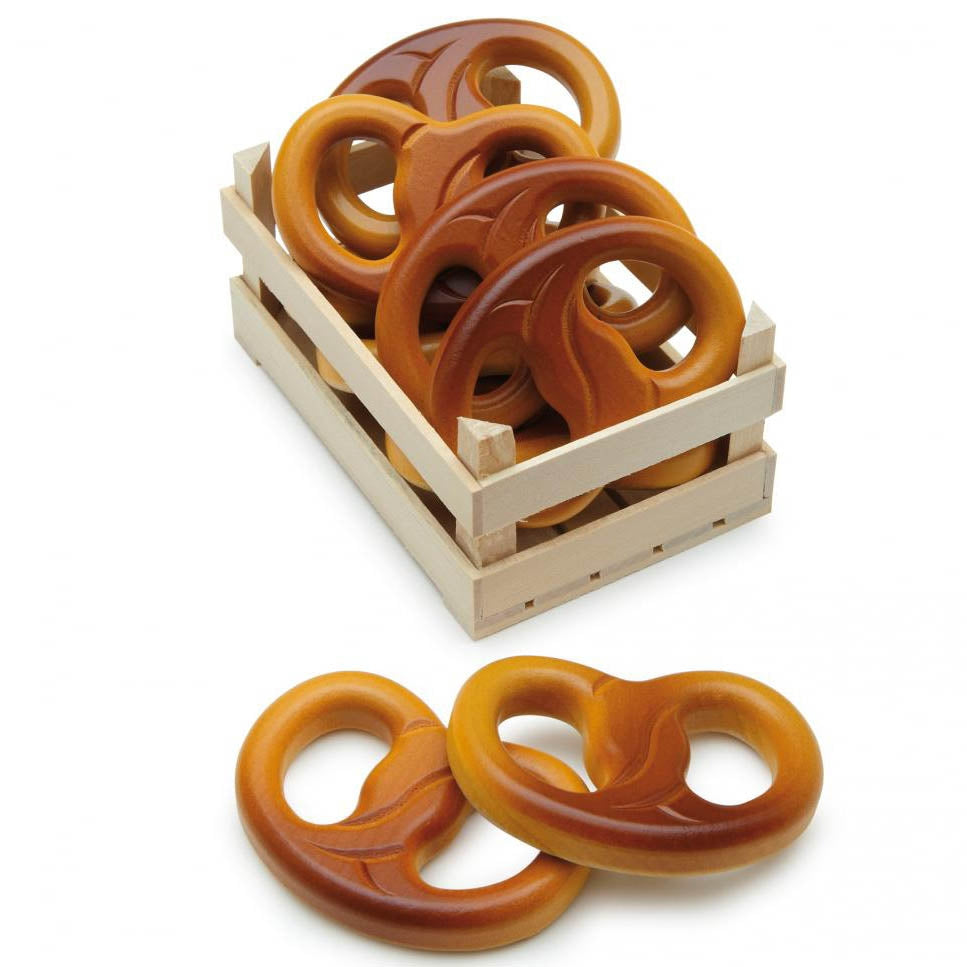 A collection of Erzi Pretzel Wooden Play Food in a wooden crate