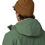 A close up of the back of the brown beanie.
