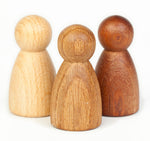 oak and sapeli wood with a natural oiled finish. Simple and tactile peg dolls for Waldorf story telling and small world play. Child paying with nins.