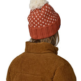 The back of the red and cream bobble Patagonia beanie