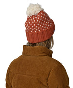 The back of the red and cream bobble Patagonia beanie