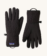 A pair of black Patagonia fleeced gloves on a cream background.