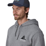 A male adult wearing the navy Patagonia trucker hat.