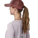 A side view of the pink Patagonia trucker hat