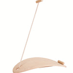 The PlanToys Balance Board shown upturned with the rope attached to one side on a plain background. 