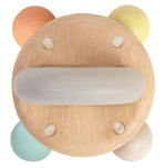 A top view of the PlanToys Pastel Bell Rattle on a plain background. 