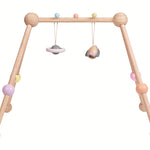 The PlanToys Pastel Play Gym on a plain background. 
