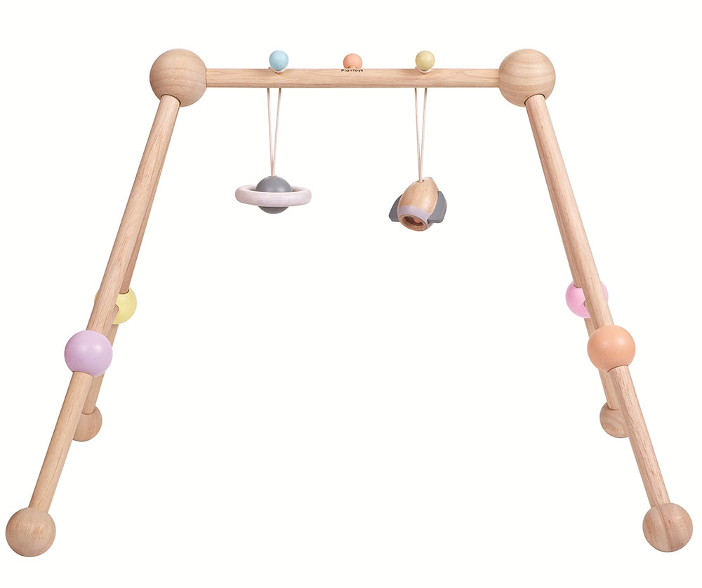The PlanToys Pastel Play Gym on a plain background. 