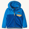 Blue kids Patagonia fleece with a gold pocket on a cream background