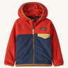 Red and navy kids Patagonia fleece on a cream backgorund