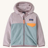 Light pink and blue kids Patagonia fleece on a cream background