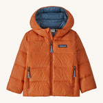 Orange kids Patagonia down jacket on a cream background