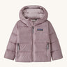 Light pink kids Patagonia down jacket on a cream background
