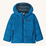 Light blue kids Patagonia down jacket on a cream background