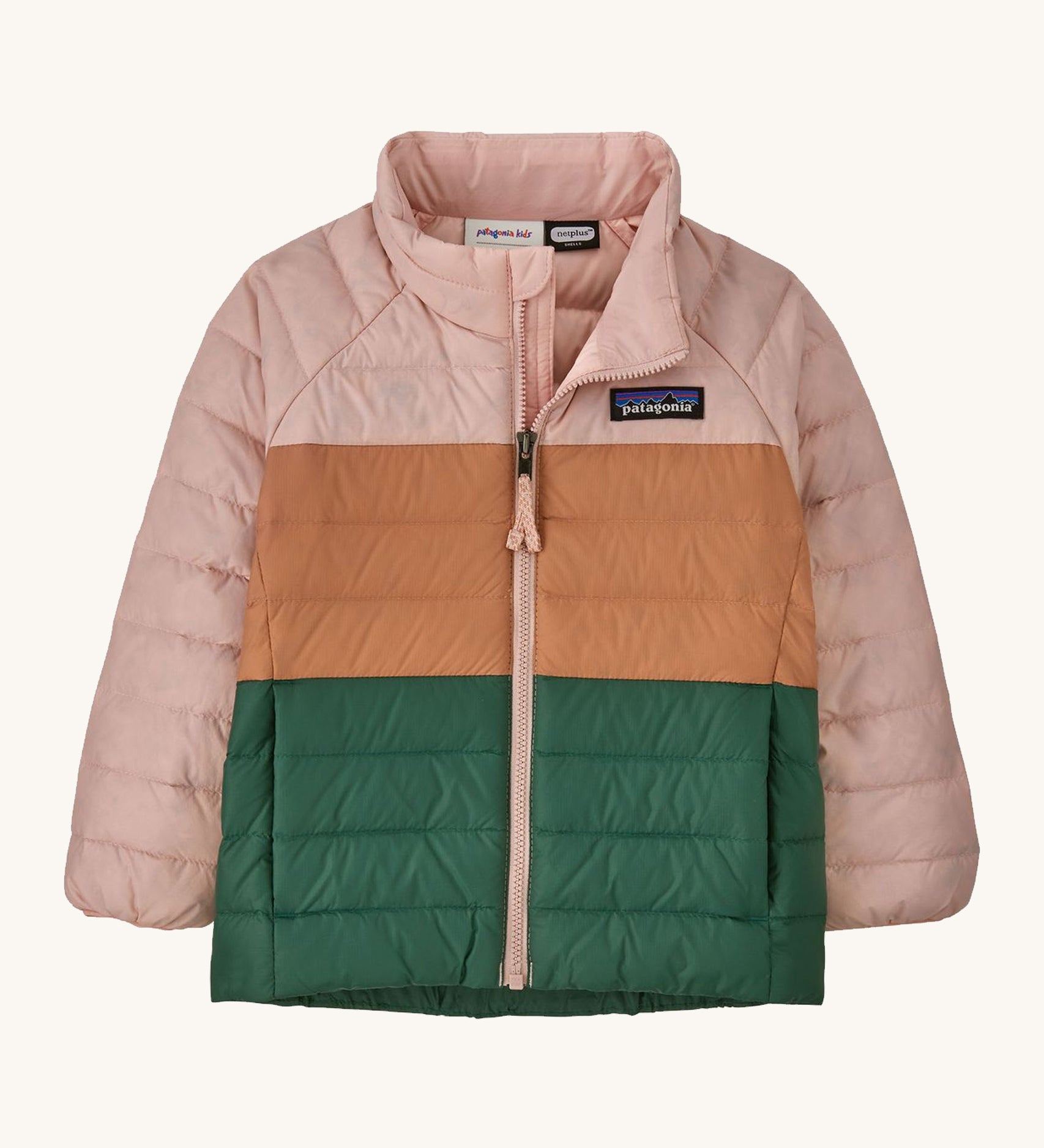 Light pink, brown and green kids Patagonia jacket on a cream background