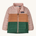 Light pink, brown and green kids Patagonia jacket on a cream background