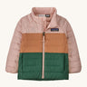 Light pink, brown and green kids Patagonia jacket on a cream background