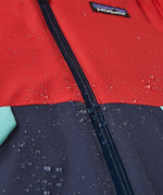 A close up of jacket with water dripping off