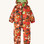 A orange all in one snowsuit with different coloured shapes on a cream background