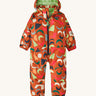 A orange all in one snowsuit with different coloured shapes on a cream background