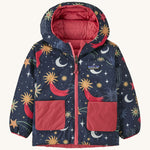 Navy Patagonia reversible jacket with a moon and stars design and red pockets on a cream background
