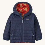 Navy Patagonia jacket with a fox reversible print on the inside on a cream background
