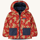 The reversible fox print Patagonia jacket on a cream background