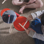 an eco-friendly and plastic-free wooden drum kit for toddler's on a white background.