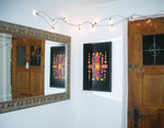 A Grimm's Large magnetic puzzle board on a wall with colourful art work