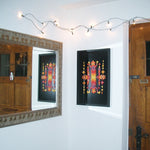 A Grimm's Large magnetic puzzle board on a wall with colourful art work