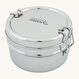 A slice of green chapra two tier round lunchbox available at Babipur. A two tier stainless steel lunchbox with a clip fastener on each side 