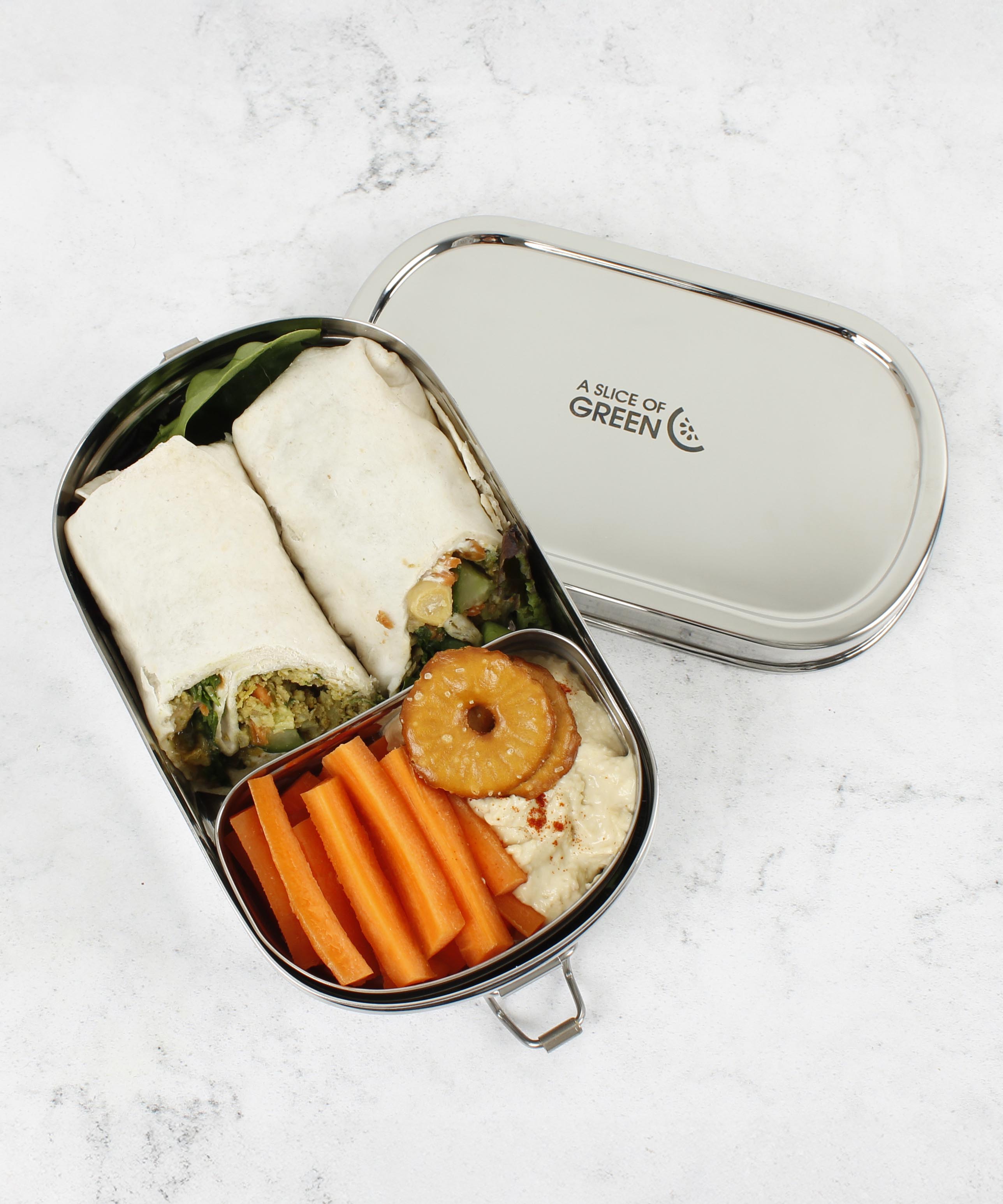A top down image of the A slice of green oval lunchbox with mini container with food inside