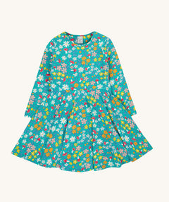 The Frugi Sofia skater dress with a wild woods print design on a green background. The print features flowers and toadstools.