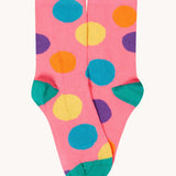 The pink multi-coloured spotted socks from the Frugi rock my socks flowers socks multi-pack of children's organic cotton socks.